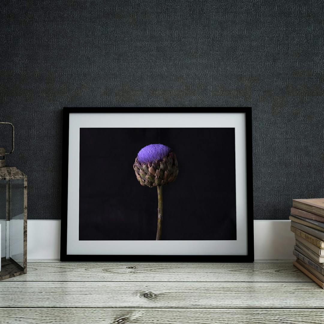 Picture frame mockup against dark wall. Interior.