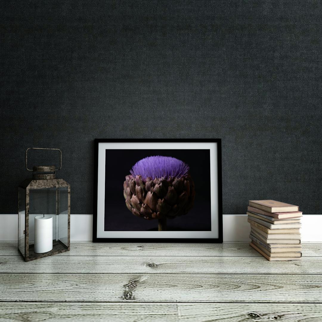 Picture frame mockup against dark wall. Interior.