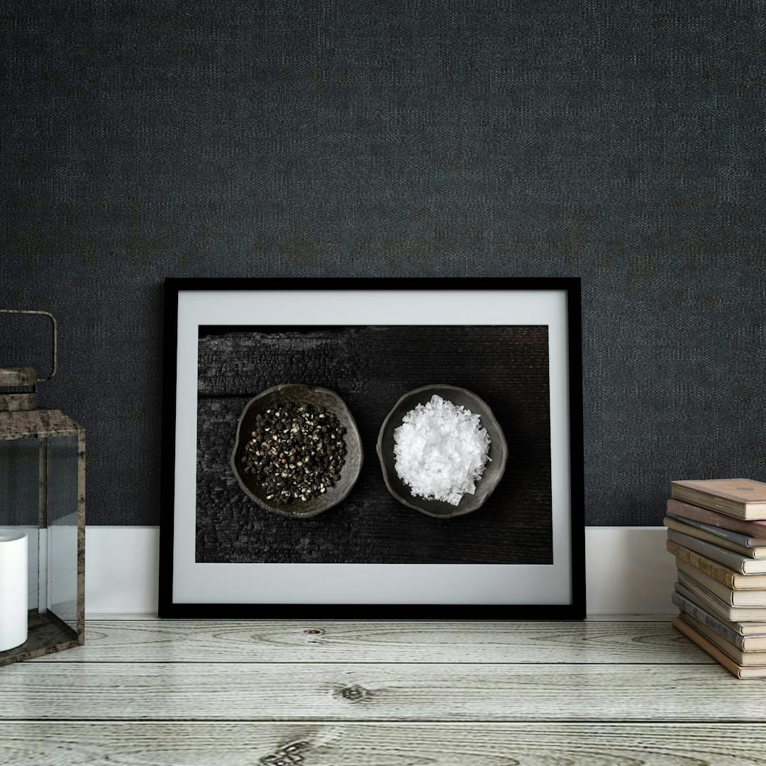 Picture frame mockup against dark wall. Interior.